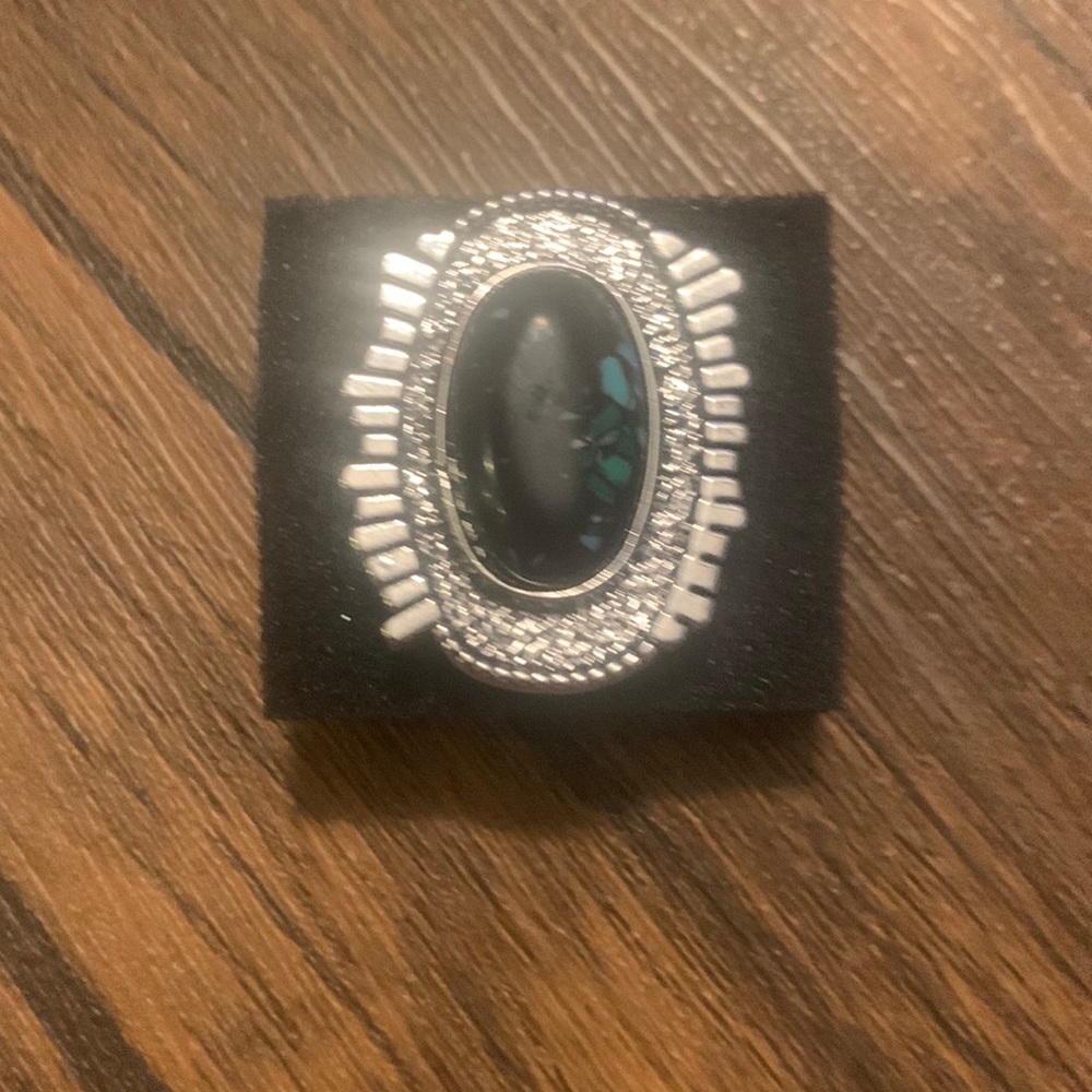 Ring- black oval stone with a touch of green/turquoise crackle look in the stone